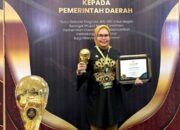 Bupati Merlan Uloli Terima Penghargaan UHC Award 2024