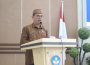 Sekda Iwan Mustapa saat memberikan sambutan dan membuka kegiatan Konferensi V PGRI Kabupaten Bone Bolango dengan tema "Transformasi PGRI Menuju Indonesia Emas", di BPMP Gorontalo, Kamis (22/5/2025). (F.AKP)