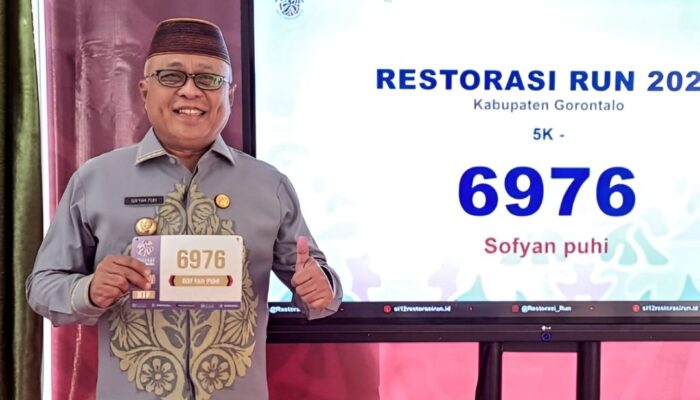 Bupati Sofyan Puhi Jadi Peserta Pertama Ambil Race Pack Restorasi Run 2025