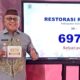 Bupati Gorontalo Sofyan Puhi saat mengambil Race Pack Restorasi Run 2025/Hibata.id