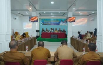 Bupati Asahan Taufik Zainal Abidin memimpin HLM TPID 2025 di Kisaran. Bank Indonesia menekankan penguatan UMKM, distribusi, dan digitalisasi transaksi untuk menekan inflasi daerah/Hibata.id