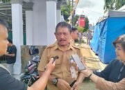 Kepala Dinas Perdagangan, Koperasi, dan UKM Kota Kotamobagu, Ariono Potabuga saat diwawancarai media. (Foto: Istw)