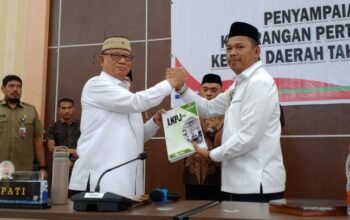 Bupati Bone Bolango Ismet Mile dalam Rapat Paripurna DPRD saat penyampaian Laporan Keterangan Pertanggungjawaban (LKPJ)/Hibata.id