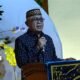 Bupati Gorontalo Sofyan Puhi saat memberikan sambutan di kegiatan doa pemberangkatan Calon Jamaah Haji (JCH) tahun 1447 H/2026 di Desa Bulota, Kecamatan Telaga Jaya, Kabupaten Gorontalo, Kamis (16/4/2026). (Foto: Humas Pemkab Gorontalo)