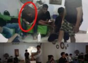 Tangkapan Layar - Potongan video saat aparat kepolisian melakukan penertiban di sebuah rumah di Kecamatan Kota Tengah, Kota Gorontalo, yang rekamannya kemudian beredar luas di media sosial/Hibata.id
