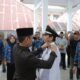 Wali Kota Kotamobagu, Weny Gaib, melantik Junaidi Simbala sebagai Penjabat Sangadi Desa Moyag Tampoan. (Foto: Humas)