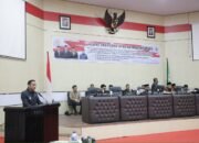 Wali Kota Kotamobagu, Weny Gaib, menyampaikan Rancangan Peraturan Daerah (Ranperda) tentang Pertanggungjawaban Pelaksanaan APBD Kota Kotamobagu Tahun Anggaran 2025 dalam Rapat Paripurna DPRD Kota Kotamobagu, Senin, 29 Juni 2026. (Foto: Humas)