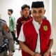 Terdakwa Muhammad Amin Ramadhan saat digiring menuju ruang sidang Pengadilan Negeri (PN) Gorontalo untuk mengikuti persidangan/Hibata.id
