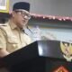 Wakil Wali Kota Gorontalo Indra Gobel saat membacakan nota keuangan dan rancangan peraturan daerah (Ranperda) tentang perubahan APBD Kota Gorontalo tahun anggaran 2026 dalam rapat paripurna di Aula I Kantor DPRD Kota Gorontalo, Senin, 14 September 2026. (Foto: Humas)