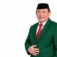Yusbar Ismail mengenakan jas PPP dalam prosesi bergabungnya dengan Partai Persatuan Pembangunan di Kecamatan Suwawa, Bone Bolango/Hibata.id