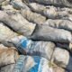 Tumpukan material batu hitam, yang disebut telah dikeluarkan dari gudang yang dipasangi garis polisi dan dipindahkan ke wilayah Kabila, Kabupaten Bone Bolango/Hibata.id